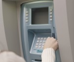 Woman Using Atm Machine Woman Using Atm Machine